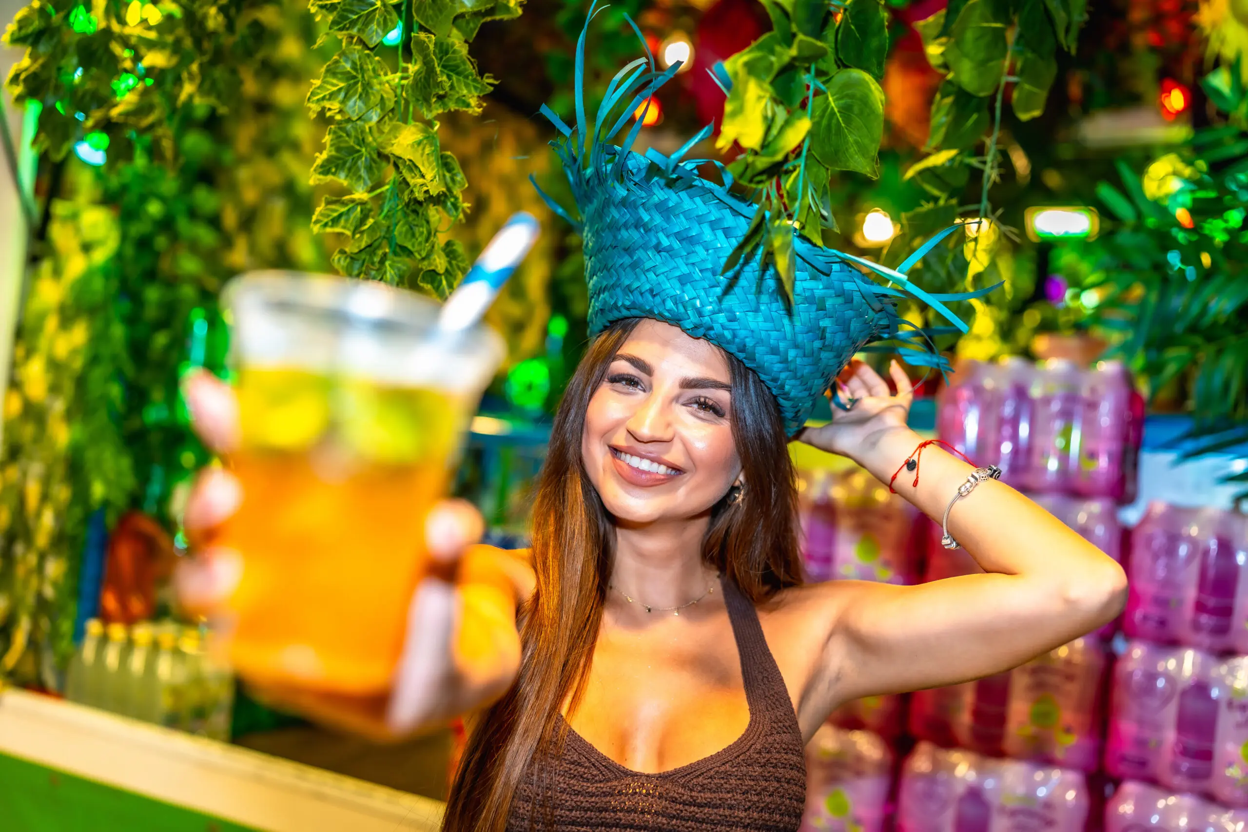 Bartender offering tropical cocktail at a bar