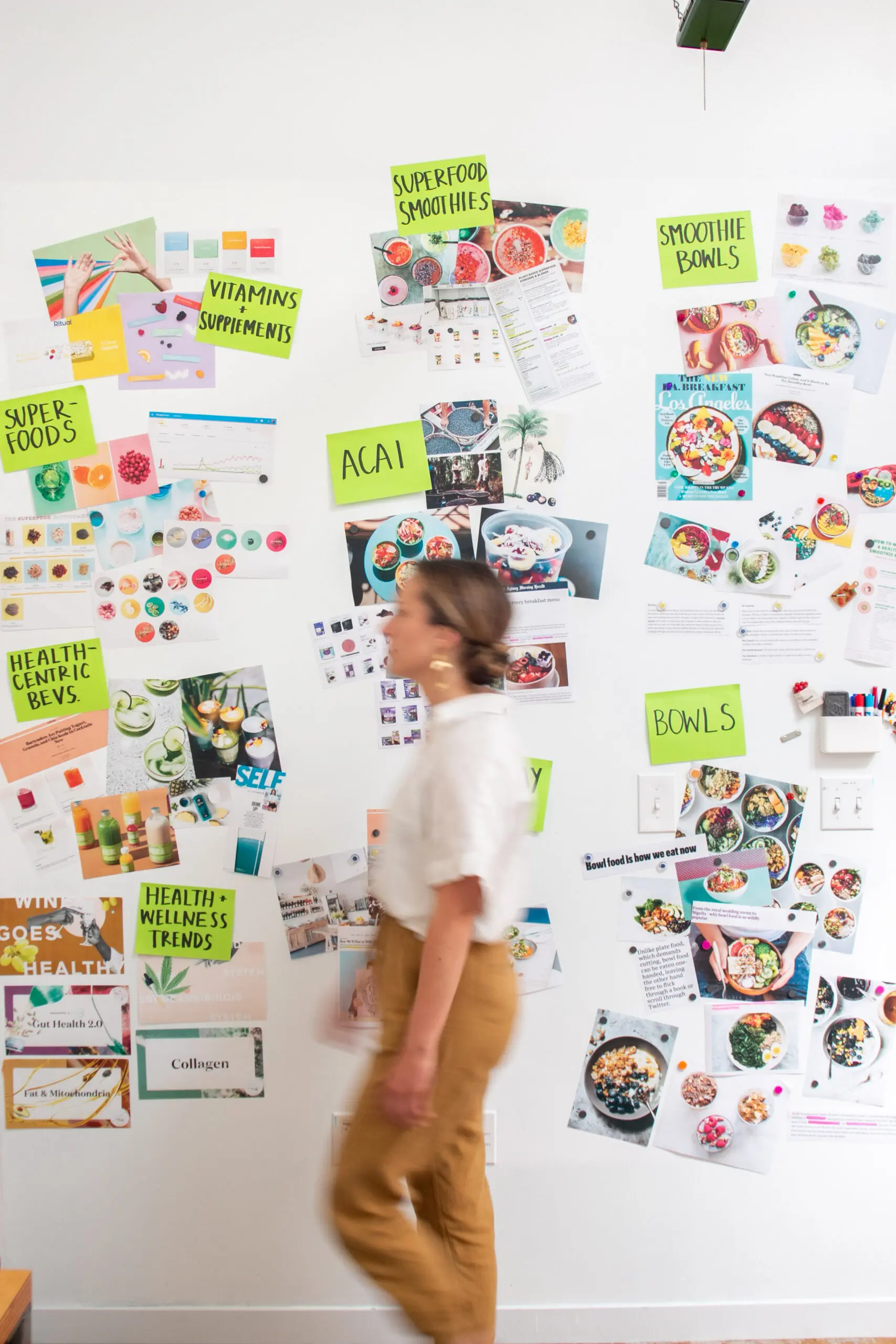 WOMAN IN FRONT OF MOOD BOARD