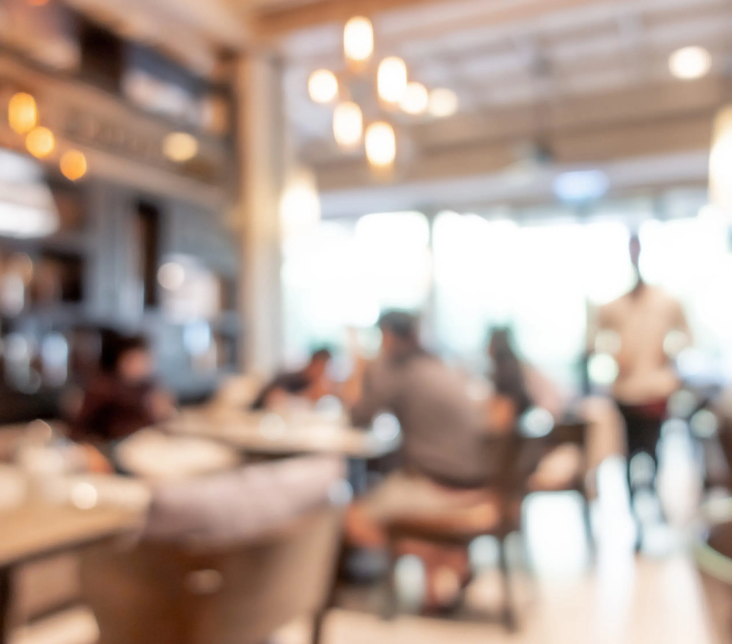 Blurred view of a busy restaurant dining room