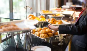Assorted breakfast pastries on a self-serve hotel buffet.
