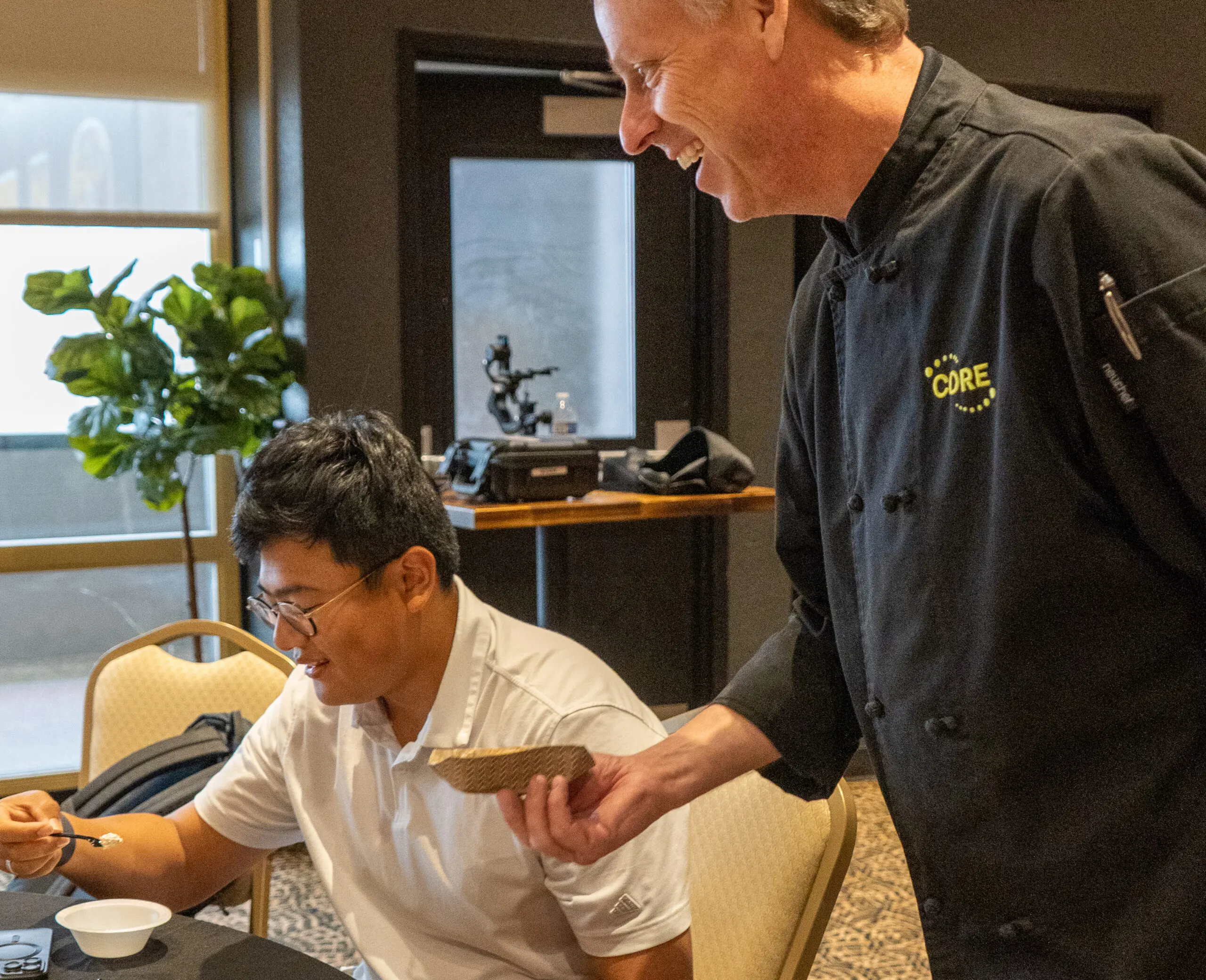 CORE Chef serving a sample to an operator during a demo testing.