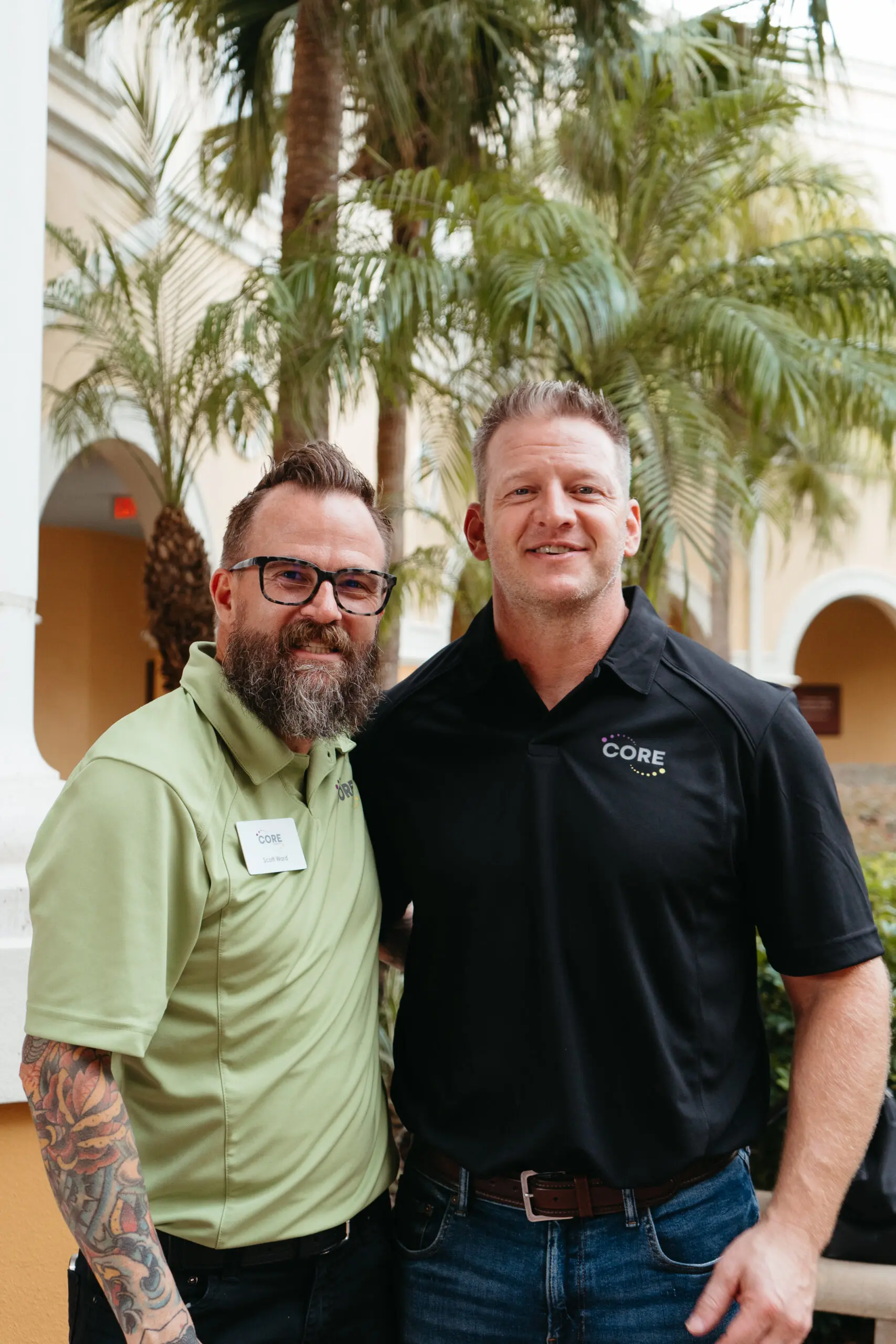 Two CORE sales leaders standing together on-site.